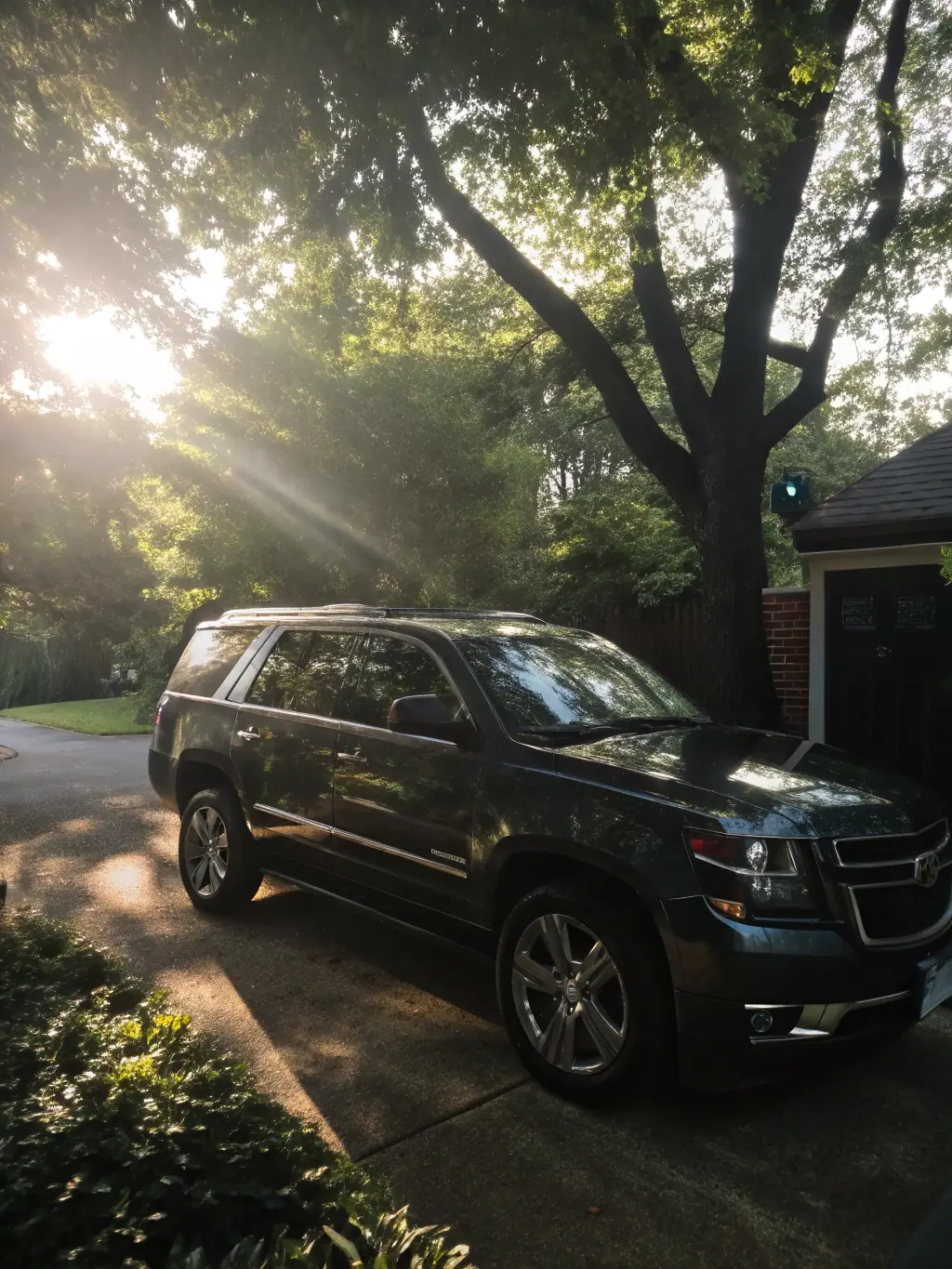 A clean, silver sedan parked in a residential driveway, showcasing the convenience of Jonesy's mobile express wash service.